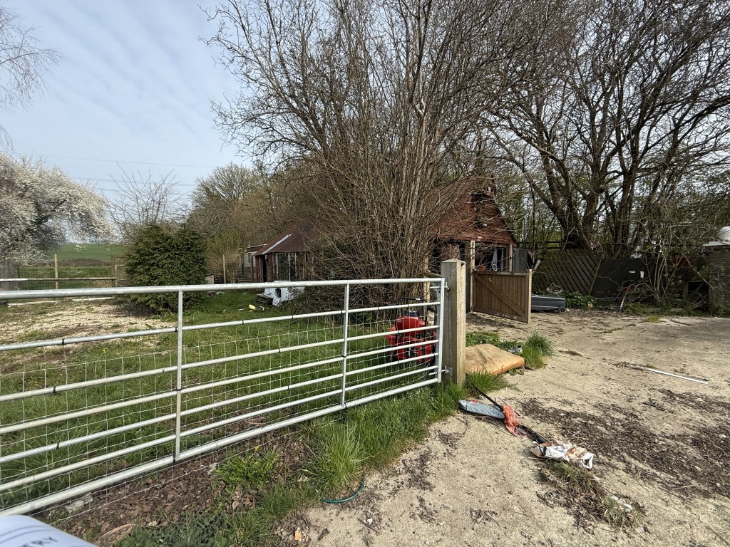 Lot: 144 - DETACHED COTTAGE WITH OUTBUILDING AND STABLES ON A SITE MEASURING OVER SIX ACRES - Double garage and static caravan behind